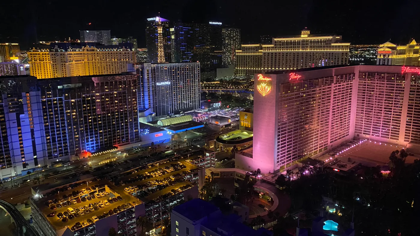 Las Vegas hotels illuminated at night, viewed through a cabin window